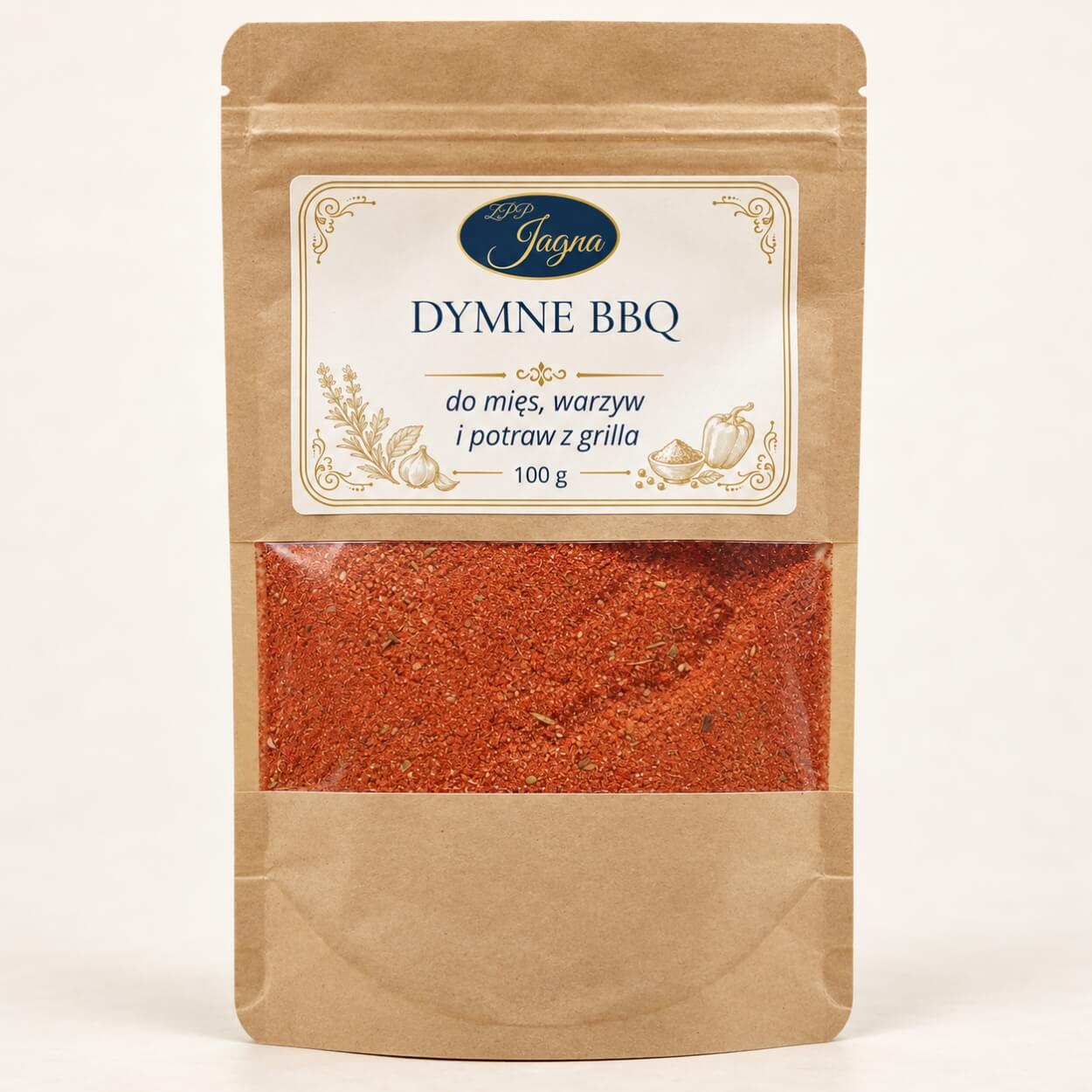 Dymne BBQ 100 g ZPP Jagna w opakowaniu kraft z przezroczystym okienkiem, na kremowym tle.